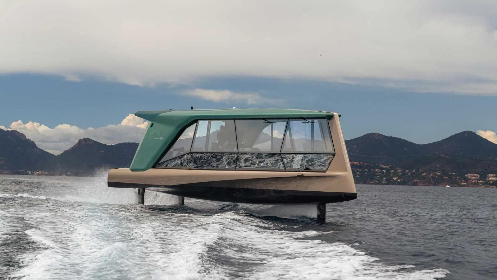 a futuristic yacht "THE ICON" by BMW & TYDE, moving at speed on the water