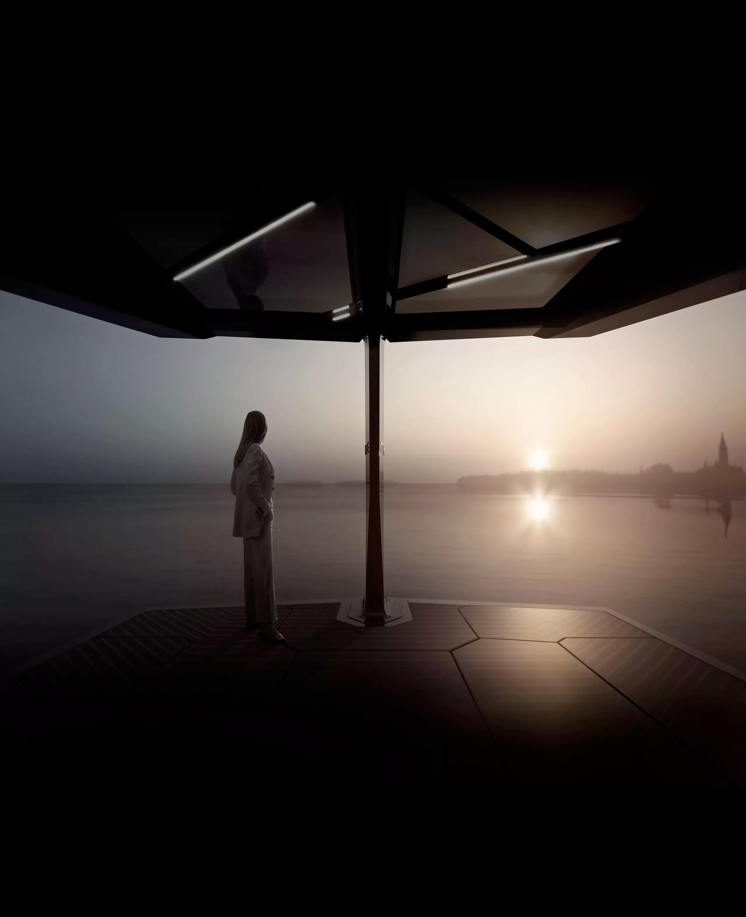person standing on a deck of the ICON by TYDE, gazing at a sunset over the water